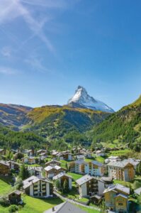 Traditional alpine village of Zermatt with the iconic snow-dusted Matterhorn peak in the background.