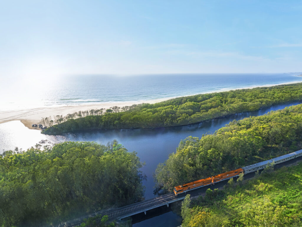 Great Southern train crossing a scenic coastal river near Coffs Harbour, New South Wales.